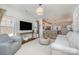 Bright living room with hardwood floors, white walls and large windows at 6503 Revolutionary Trl, Charlotte, NC 28217