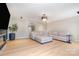 Spacious living area with wood floors, a large sectional, and a modern aesthetic at 6503 Revolutionary Trl, Charlotte, NC 28217
