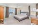 Cozy bedroom with neutral colors, a large window, and plush carpeting at 6503 Revolutionary Trl, Charlotte, NC 28217