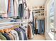 Organized walk-in closet featuring built-in shelving and ample storage space for clothes and accessories at 6503 Revolutionary Trl, Charlotte, NC 28217