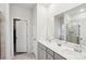 Bathroom features double sinks with framed mirror, neutral-colored walls and flooring, and glass-enclosed shower at 6509 Gopher Rd, Lancaster, SC 29720