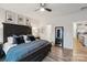 Primary bedroom with a modern farmhouse design features luxury bedding, a ceiling fan and access to ensuite at 6509 Gopher Rd, Lancaster, SC 29720