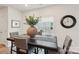 Comfortable dining area features a dark wood table with seating for four and an abundance of natural light at 6509 Gopher Rd, Lancaster, SC 29720