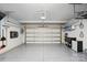 Clean garage with epoxy floors, work bench, and garage door with opener at 6509 Gopher Rd, Lancaster, SC 29720