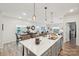 Bright, open-concept kitchen featuring a large island, modern pendant lighting, and stainless steel appliances at 6509 Gopher Rd, Lancaster, SC 29720
