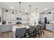 Modern kitchen boasts stainless steel appliances, white countertops, and a large center island with seating at 6509 Gopher Rd, Lancaster, SC 29720