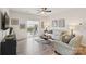 Bright living room features light wood floors, neutral walls, ceiling fan and sliding glass doors to outside at 6509 Gopher Rd, Lancaster, SC 29720