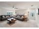Bright living room with two comfortable leather sofas, side tables, and modern ceiling fan at 6509 Gopher Rd, Lancaster, SC 29720
