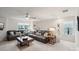 Bright living room with two comfortable leather sofas, side tables, and modern ceiling fan at 6509 Gopher Rd, Lancaster, SC 29720