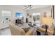 Bright living room features light wood floors, neutral walls, ceiling fan and sliding glass doors to outside at 6509 Gopher Rd, Lancaster, SC 29720
