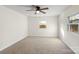 Sunlit bedroom with neutral carpet and a window providing natural light at 717 Perth Rd, Troutman, NC 28166