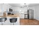 Bright kitchen featuring white cabinets, butcher block countertops, and stainless steel appliances at 717 Perth Rd, Troutman, NC 28166
