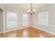Bright dining room with hardwood floors, decorative lighting and bright windows at 775 Summerwood Dr, Rock Hill, SC 29732