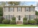 Charming two-story home featuring a symmetrical facade, manicured bushes and classic black shutters at 775 Summerwood Dr, Rock Hill, SC 29732