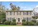 Charming two-story home featuring a symmetrical facade, manicured bushes and classic black shutters at 775 Summerwood Dr, Rock Hill, SC 29732