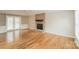 Bright living room with hardwood floors, brick fireplace, built-in shelving and sliding glass doors at 775 Summerwood Dr, Rock Hill, SC 29732