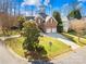 Beautiful brick home features manicured landscaping, a spacious driveway, and an inviting front entrance at 8020 Harrington Woods Rd, Charlotte, NC 28269