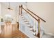 Welcoming foyer with soaring ceilings, gleaming hardwood floors, and elegant staircase at 8020 Harrington Woods Rd, Charlotte, NC 28269