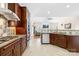 Spacious kitchen with stainless steel appliances, custom cabinets, and view into the living room at 8020 Harrington Woods Rd, Charlotte, NC 28269