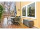Relaxing back deck with outdoor seating, perfect for enjoying the serene backyard view at 8133 Strawberry Ln, Charlotte, NC 28277
