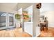 Light-filled dining area showcases stylish decor, hardwood floors, and convenient outdoor access at 8133 Strawberry Ln, Charlotte, NC 28277