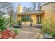 Inviting front porch with seating area and lush landscaping for outdoor relaxation and enjoyment at 8133 Strawberry Ln, Charlotte, NC 28277