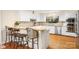 Well-maintained kitchen with stainless steel appliances, granite countertops, and breakfast bar seating at 8133 Strawberry Ln, Charlotte, NC 28277