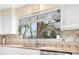 Kitchen with stainless appliances, tile backsplash and window, offering plenty of natural light and space at 8133 Strawberry Ln, Charlotte, NC 28277