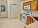 Practical kitchen layout includes pantry doors, and essential appliances at 8309 Emily Dr # 222, Harrisburg, NC 28075