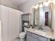 Bathroom featuring granite counters and grey cabinets at 9409 Gilpatrick Ln, Huntersville, NC 28078