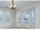 Bright dining area with large windows offering ample natural light, complemented by neutral-toned walls at 9717 Spring Park Dr, Charlotte, NC 28269