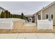 Spacious backyard with a white fence, wooden pergola, and room for outdoor activities at 105 Blossom Ridge Dr, Mooresville, NC 28117