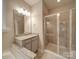 Updated bathroom with a glass shower, granite countertop and tile floors at 105 Blossom Ridge Dr, Mooresville, NC 28117