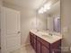 Bathroom featuring a double sink vanity with a large mirror at 105 Blossom Ridge Dr, Mooresville, NC 28117