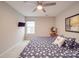 Well-lit bedroom features a flat screen television and beach-themed decor at 105 Blossom Ridge Dr, Mooresville, NC 28117