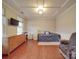 Cozy bedroom with tray ceilings, hardwood floors, and large windows, perfect for relaxation at 105 Blossom Ridge Dr, Mooresville, NC 28117