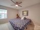 Comfortable bedroom features a ceiling fan and beach-themed decor at 105 Blossom Ridge Dr, Mooresville, NC 28117