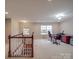 Carpeted bonus room with natural light and a desk set up, perfect for a home office at 105 Blossom Ridge Dr, Mooresville, NC 28117