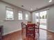 Inviting dining area with natural light, hardwood floors, and a sliding door leading to the backyard at 105 Blossom Ridge Dr, Mooresville, NC 28117