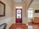 Elegant foyer with hardwood floors, detailed trim work, and natural light, creating a welcoming entrance at 105 Blossom Ridge Dr, Mooresville, NC 28117
