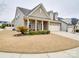 Charming single-Gathering home with manicured lawn, brick accents, and a two-car garage at 105 Blossom Ridge Dr, Mooresville, NC 28117