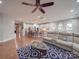 Bright living room showcases hardwood floors and an open-concept layout to the kitchen at 105 Blossom Ridge Dr, Mooresville, NC 28117