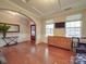 Bright living room featuring hardwood floors, neutral walls, and an arched doorway to the front entrance at 105 Blossom Ridge Dr, Mooresville, NC 28117