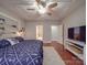 Relaxing bedroom with wood floors and access to the ensuite bathroom at 105 Blossom Ridge Dr, Mooresville, NC 28117