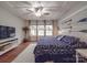 Cozy main bedroom features nautical decor, a ceiling fan, and ample natural light at 105 Blossom Ridge Dr, Mooresville, NC 28117