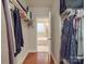 Spacious walk-in closet offers plenty of storage space and access to a bathroom with a tub at 105 Blossom Ridge Dr, Mooresville, NC 28117