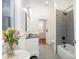 Bathroom featuring tiled floors, a modern vanity, a bathtub and shower with tiled wall and a flower vase at 116 Rose Ter, Wadesboro, NC 28170