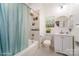 Cozy bathroom with tub and shower combination, decorative mirror, and vanity with cabinet at 116 Rose Ter, Wadesboro, NC 28170