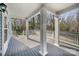 Large covered patio featuring wood floors and pillars, offering ample space for outdoor enjoyment and entertaining at 116 Rose Ter, Wadesboro, NC 28170