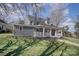Charming blue two-story home with a welcoming front porch and landscaped lawn at 116 Rose Ter, Wadesboro, NC 28170